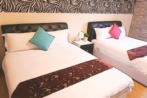 Krevet ili kreveti u jedinici u okviru objekta Donggang Hai-Wan Homestay
