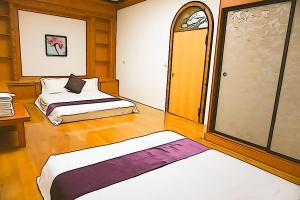 Krevet ili kreveti u jedinici u okviru objekta Donggang Hai-Wan Homestay