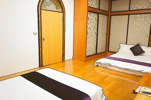 Krevet ili kreveti u jedinici u okviru objekta Donggang Hai-Wan Homestay