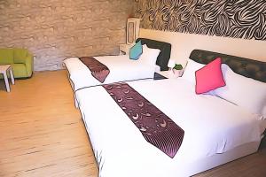 Krevet ili kreveti u jedinici u okviru objekta Donggang Hai-Wan Homestay