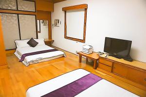 Krevet ili kreveti u jedinici u okviru objekta Donggang Hai-Wan Homestay
