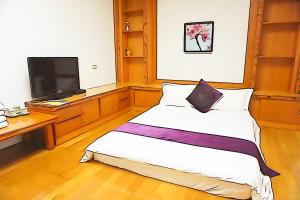 Krevet ili kreveti u jedinici u okviru objekta Donggang Hai-Wan Homestay