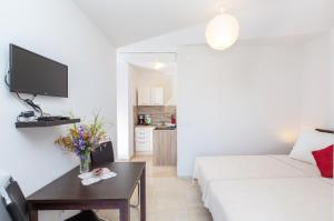 Postel nebo postele na pokoji v ubytování Apartments Elica