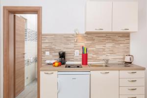 Kuchyň nebo kuchyňský kout v ubytování Apartments Elica