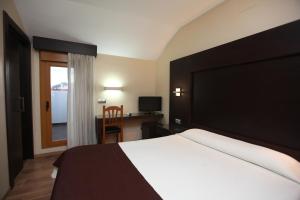 Postel nebo postele na pokoji v ubytování Hotel Anabel Baza