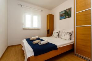 En eller flere senger på et rom på Apartments Jura