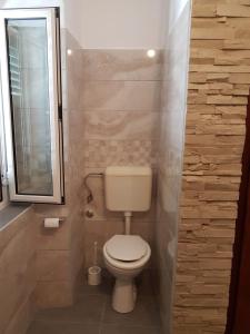 Koupelna v ubytování Apartments Mladenka