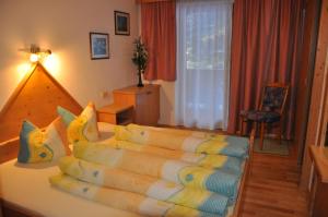a bedroom with a bed with pillows on it at Alpenspirit in Sölden