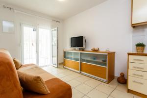 En TV eller et underholdningssystem på Apartments Jura
