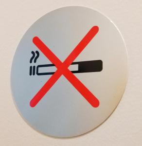 a sign with a no smoking sign on it at Casa Celsa-Barbantes in Santiago de Compostela