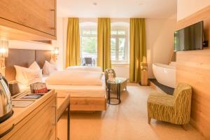 Postel nebo postele na pokoji v ubytování Hotel Hartl's Lindenmühle