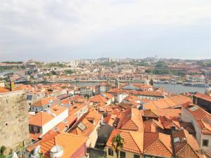 an aerial view of a city with red roofs at PipaD'oro by YoursPorto in Porto