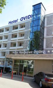 a car parked in front of a hotel oxford apartment odyssey at Hotel Ovidiu in Mamaia