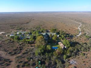 an aerial view of a house in the middle of a field at Lemoenfontein in Beaufort West