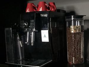a coffee maker sitting on top of a counter at Westend Hotel Kyiv in Kyiv