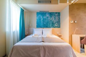 Ένα ή περισσότερα κρεβάτια σε δωμάτιο στο Garni Hotel D10
