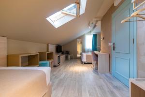 Ένα ή περισσότερα κρεβάτια σε δωμάτιο στο Garni Hotel D10