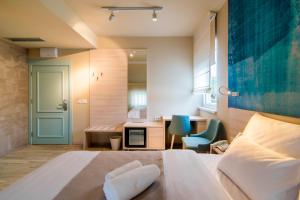 Ένα ή περισσότερα κρεβάτια σε δωμάτιο στο Garni Hotel D10