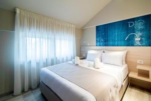 Ένα ή περισσότερα κρεβάτια σε δωμάτιο στο Garni Hotel D10