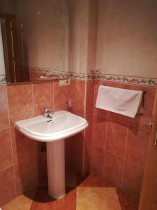 a bathroom with a sink and a mirror at Casa Rural Maria Belen in Ruidera +25 photos