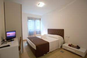 Posteľ alebo postele v izbe v ubytovaní Lacroma Aparthotel