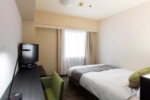 TV a/nebo společenská místnost v ubytování Takamatsu Tokyu REI Hotel
