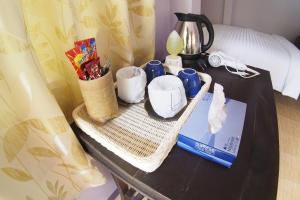 Príslušenstvo na prípravu kávy alebo čaju v ubytovaní Pan Din Boutique Guest House