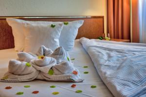 Ein Bett oder Betten in einem Zimmer der Unterkunft Hotel Residenz Limburgerhof