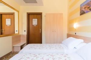 Postel nebo postele na pokoji v ubytování Albergo Trento