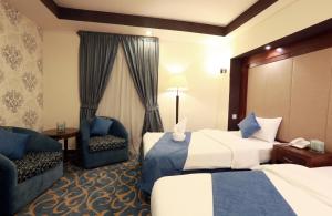 Postel nebo postele na pokoji v ubytování Burj Al Saif Hotel ـ فندق برج السيف