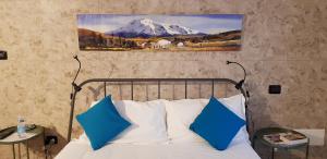 Postel nebo postele na pokoji v ubytování La Corte B&B