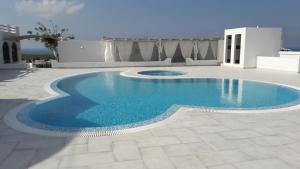 Bazén v ubytování Villa Iliovasilema Santorini nebo v jeho okolí