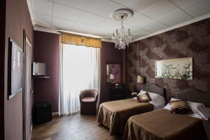 Postel nebo postele na pokoji v ubytování Hotel Residenza In Farnese