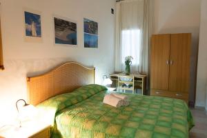Postel nebo postele na pokoji v ubytování AL BORGO VACANZE B&B