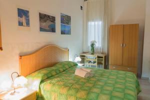 Postel nebo postele na pokoji v ubytování AL BORGO VACANZE B&B