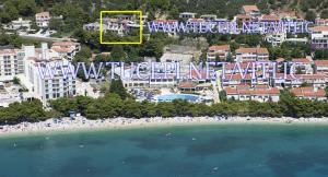 an aerial view of a resort on a beach at VILA MILENKA Apartmani Drago in Tučepi