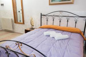 Postel nebo postele na pokoji v ubytování AL BORGO VACANZE B&B