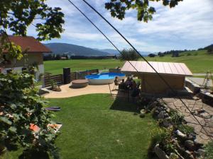 a view of a backyard with a swimming pool at Ferienhof Prinz in Oberreute
