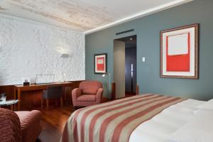 Cama o camas de una habitación en Hotel Angleterre