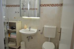 Kúpeľňa v ubytovaní Apartmani Misic