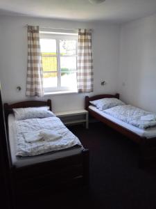 Ένα ή περισσότερα κρεβάτια σε δωμάτιο στο Javorník 88