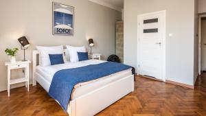 Posteľ alebo postele v izbe v ubytovaní Fenna Apartments 7 minut od Rynku
