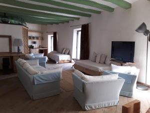Televízia a/alebo spoločenská miestnosť v ubytovaní Apartamento Poal-Cadaques