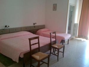 Postel nebo postele na pokoji v ubytování GFH - Hotel Spiaggia D'Oro