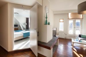 Postel nebo postele na pokoji v ubytování Hotel Grand Cafe Deight