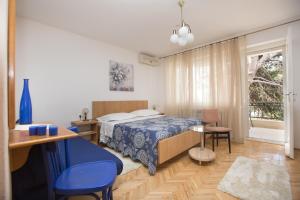 Posteľ alebo postele v izbe v ubytovaní Apartments Staničić