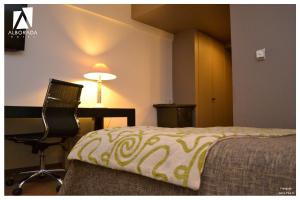 Posteľ alebo postele v izbe v ubytovaní Hotel Alborada