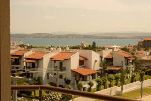 a view of a city with houses and the water at Lord Hotel in Cesme