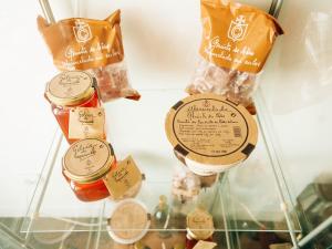 a shelf with jars of food in a refrigerator at Casa das Barcas in Lourinhã