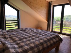 En eller flere senge i et værelse på Ferienhaus am Nationalpark